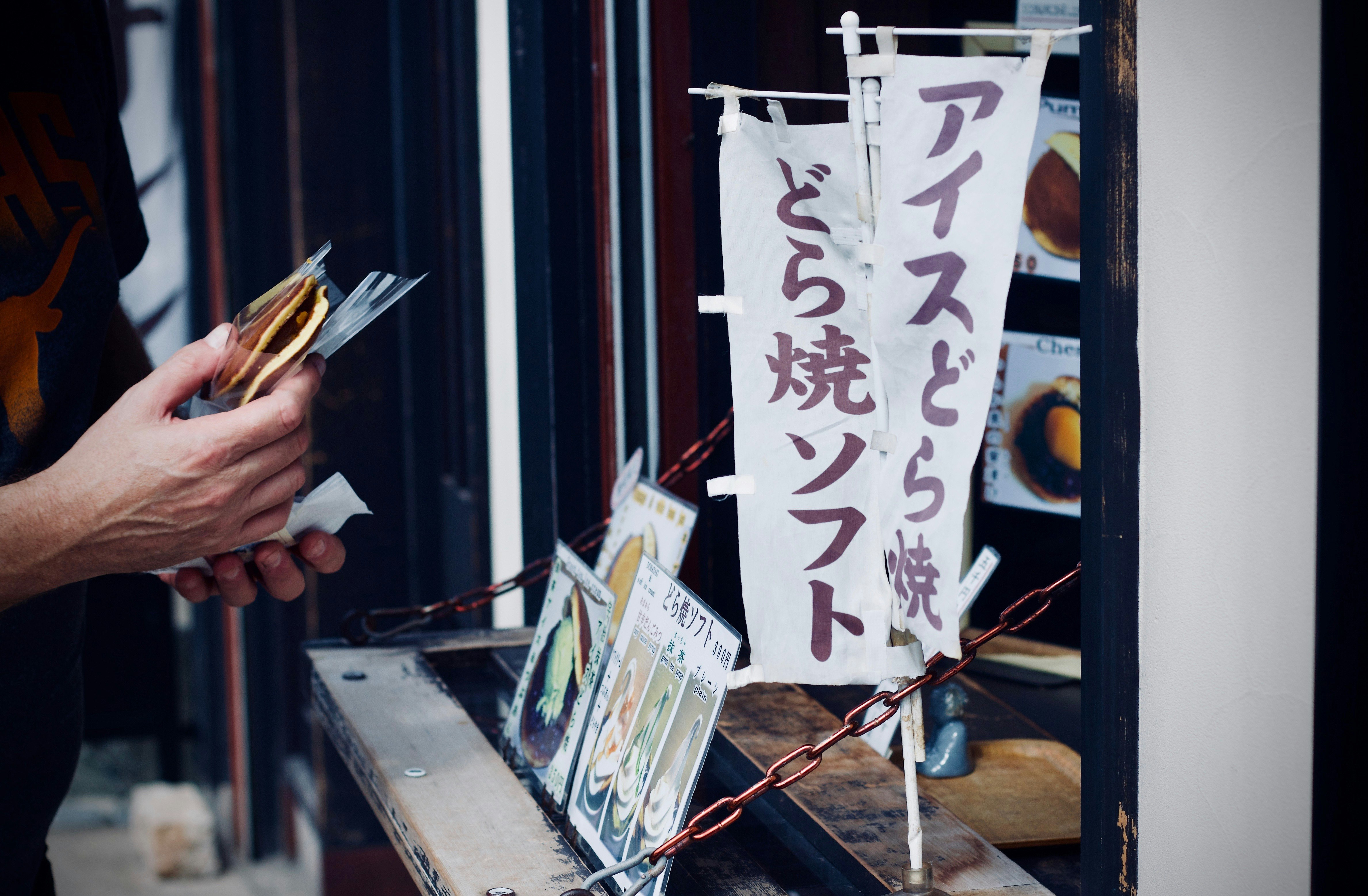 photo of person holding food